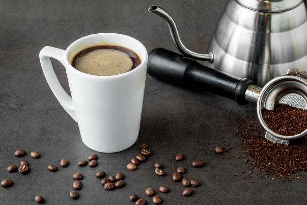 istock Relaxing americano coffee in white porcelain cup on stone table 1346118757
