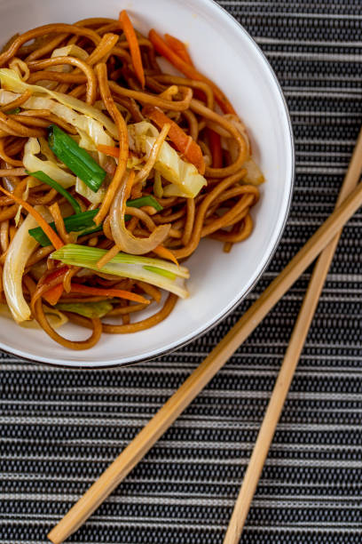 istock Vegetarian noodle bowl with vegetables on black and white background 1346118821