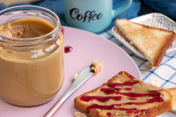 istock Breakfast on a plate. Toast with peanut butter and jam. Toaster bread. 1346119547