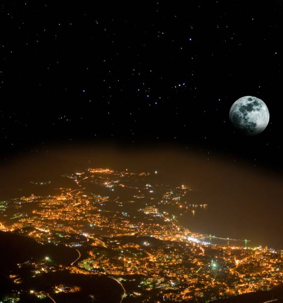 istock shining town at the night under a huge moon 1346119554