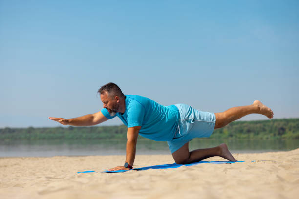 istock Man exercising outdoors at the beach on a fine day 1346121077