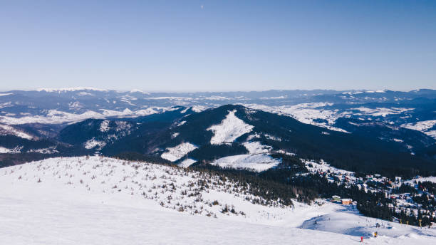 istock panoramic view of winter snowed mountains 1346121961
