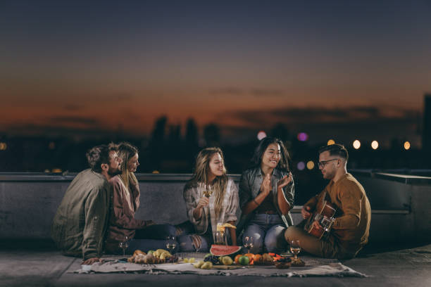 istock Guitar music during picnic night on a roof! 1346123757