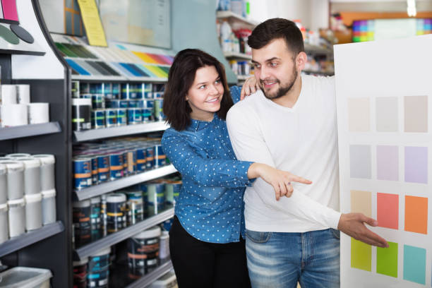istock Couple deciding on best color scheme 1346123883