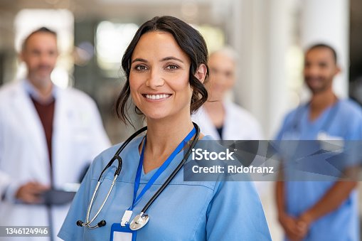 istock Portrait of friendly nurse smiling at hospital 1346124946