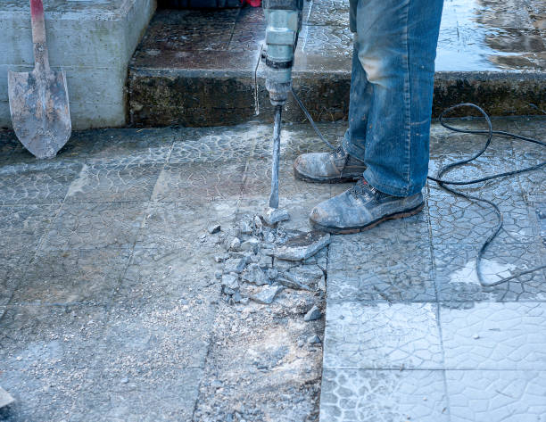 istock The construction worker is drilling the floor. Construction technicians use electric hammer chisels to destroy the ground. 1346125734