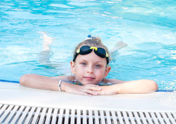 istock Little girl swiming in the pool 1346126366