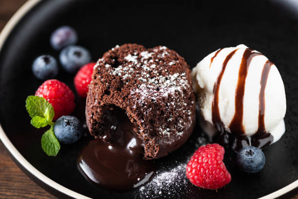 istock Chocolate fondant cake with ice cream scoop 1346128965