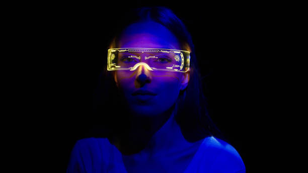 istock Projection on a woman's face wearing futuristic glasses 1346129205