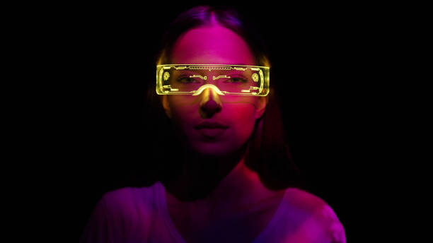 istock Projection on a woman's face wearing futuristic glasses 1346129214