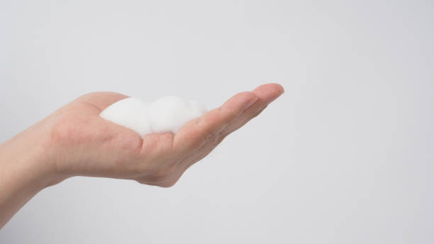 istock Hand with foaming hand soap and bubble for wash and rinse off on white background. 1346129246