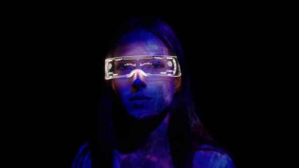 istock Projection on a woman's face wearing futuristic glasses 1346129259
