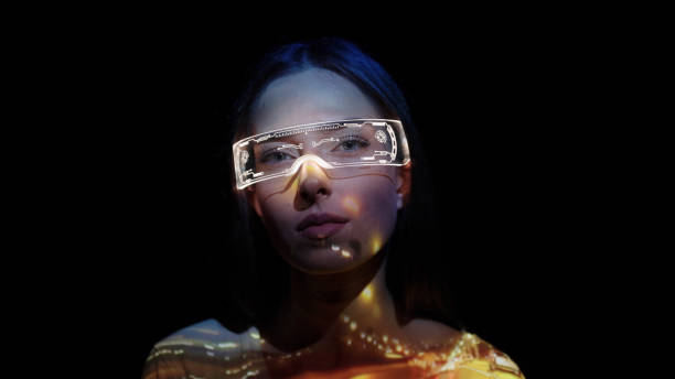 istock Projection on a woman's face wearing futuristic glasses 1346129285