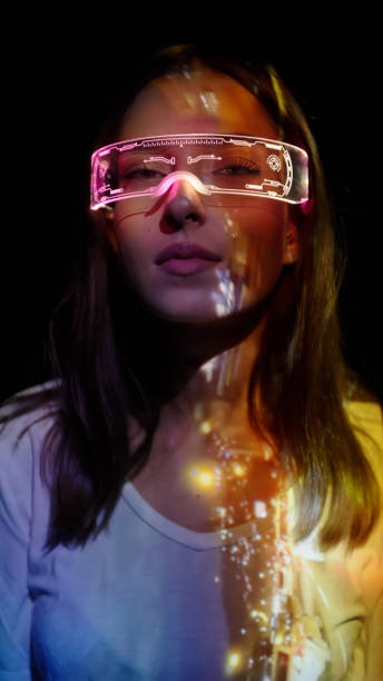 istock Projection on a woman's face wearing futuristic glasses 1346129339