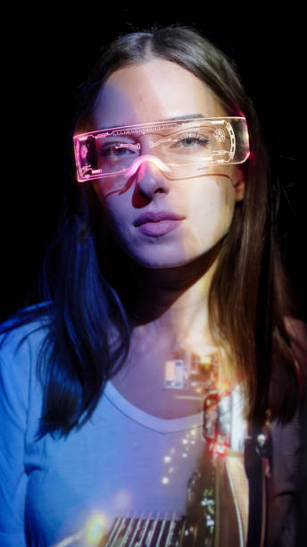 istock Projection on a woman's face wearing futuristic glasses 1346129361