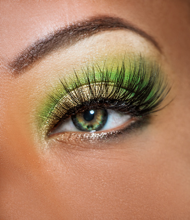 Close up of mixed race female eye, eyebrow, eyelashes and makeup