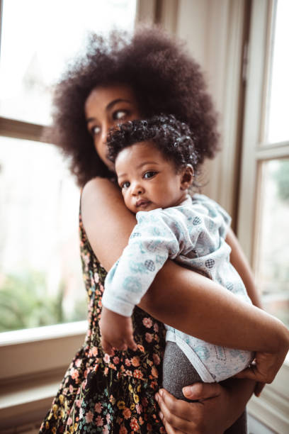 woman embracing her little kid