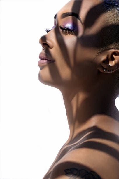 istock Headshot of a female face behind summer shadow 1346129932