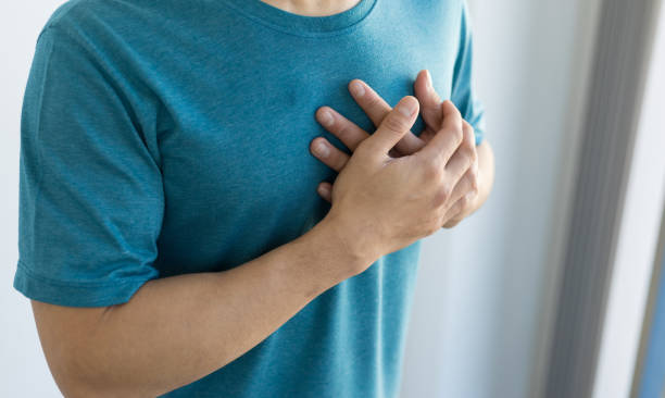 Man has chest pain. Concept of recurrent heart disease and lung disease. stock photo
