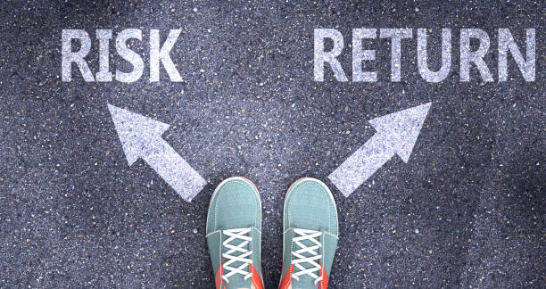 istock Risk and return as different choices in life - pictured as words Risk, return on a road to symbolize making decision and picking either Risk or return as an option, 3d illustration 1346131674