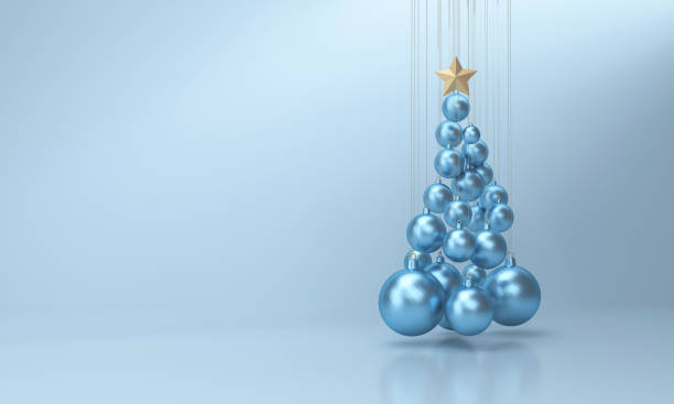 istock Christmas tree made with christmas balls on blue studio background. 1346133673