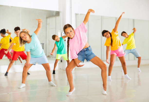 istock Tween girl krump dancer in choreographic studio with children 1346135529