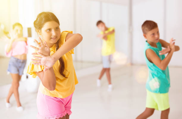 istock Children studying modern style dances in class indoors 1346135579