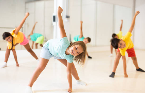 istock Young girls and boys performing dance in studio 1346135599
