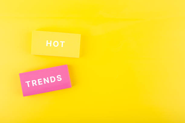 istock Hot trends written on colorful rectangles on light yellow background with copy space 1346137354
