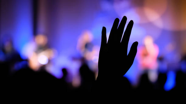 istock Hand raising concert, Hand raising for religion 1346138624