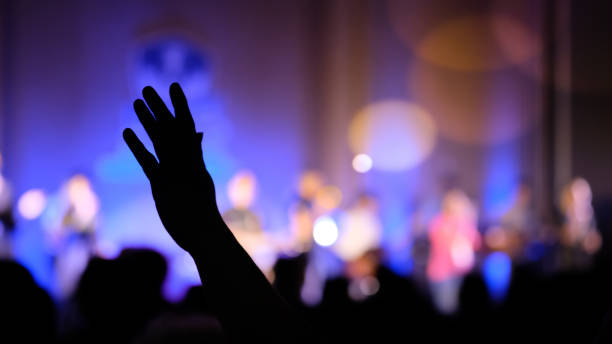 istock Hand raising concert, Hand raising for religion 1346139294