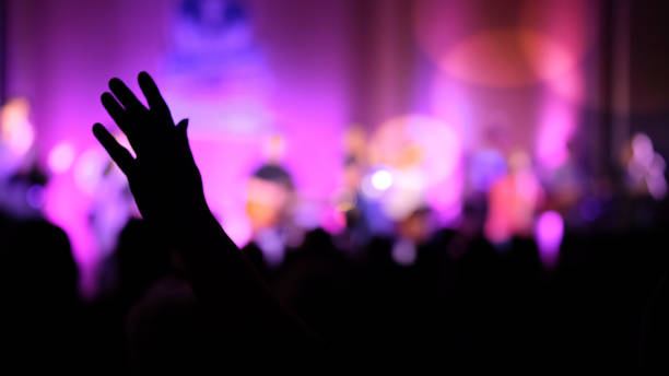 istock Hand raising concert, Hand raising for religion 1346139376