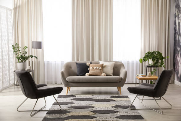 istock Modern living room interior with comfortable sofa and armchairs 1346139764