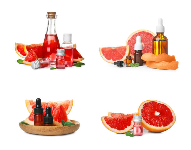 istock Set with bottles of essential oils and fresh grapefruits on white background 1346140362