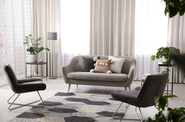 istock Modern living room interior with comfortable sofa and armchairs 1346140418