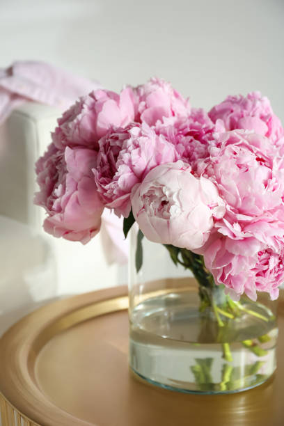 istock Bouquet of beautiful peonies on table indoors 1346142238
