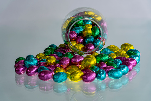 Multi-colored Easter eggs wrapped in foil.