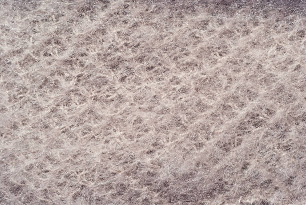 istock Goat wool fabric. Mohair close up. Beige knitted fabric. 1346142417