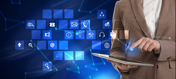 istock Businesswoman using digital tablet and different icons on blue background, closeup. Technical support service 1346142598