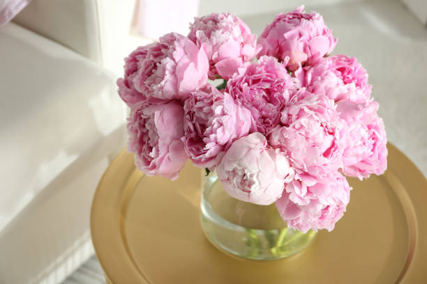 istock Bouquet of beautiful peonies on table indoors 1346142700