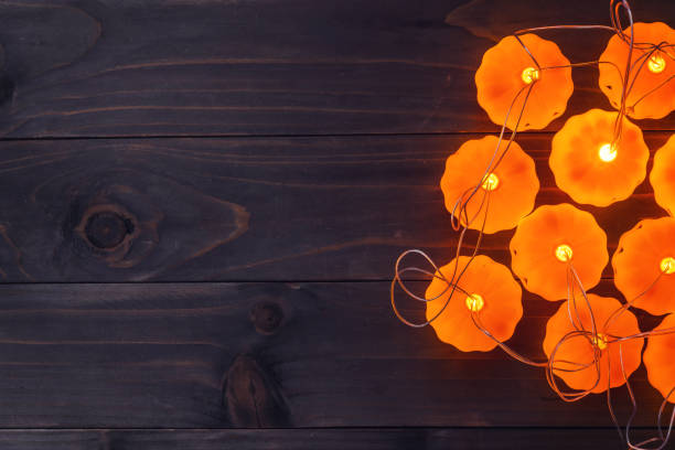 istock Halloween background, Pumpkin String Lights On Wooden Table 1346142778