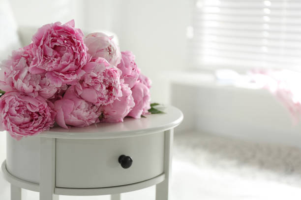 istock Bunch of beautiful peonies on table indoors. Space for text 1346143031