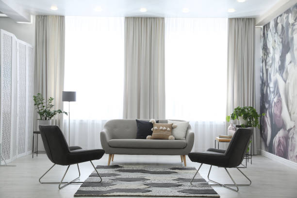 istock Modern living room interior with comfortable sofa and armchairs 1346144177
