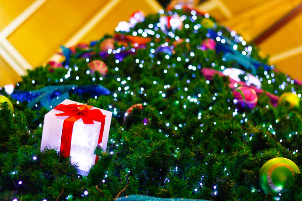 istock Christmas tree decorated with electric light and colorful balls. 1346144491