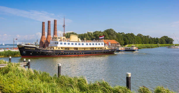 Panorama of a passenger ship in historic city Enkhuizen Panorama of a passenger ship in historic city Enkhuizen, Netherlands lime kiln lighthouse stock pictures, royalty-free photos & images