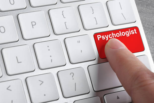 istock Woman pressing button with word PSYCHOLOGIST on computer keyboard, closeup 1346144866