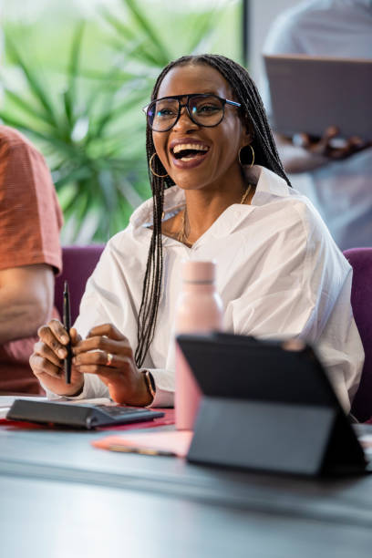 istock Sitting Cheerfully In The Boardroom 1346145446