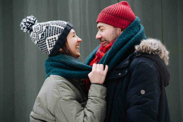 istock Cheerful couple standing in front of each other outdoors at winter 1346145498