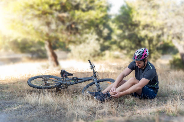 istock A young cyclist lying on the ground after suffering a fall from his bicycle 1346146037