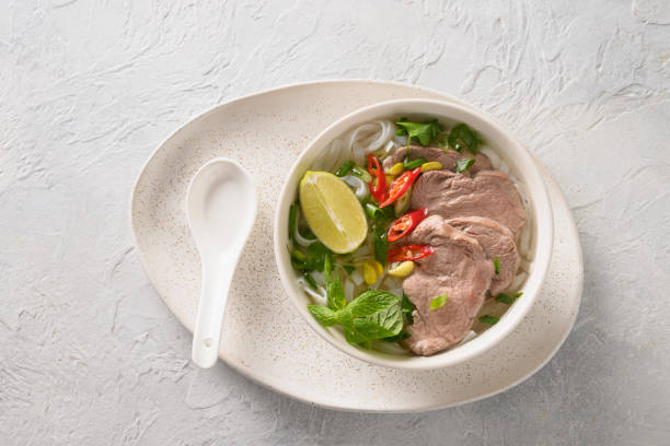 istock Pho Bo Soup with beef in bowl on black backgound. Vietnamese cuisine. 1346147640